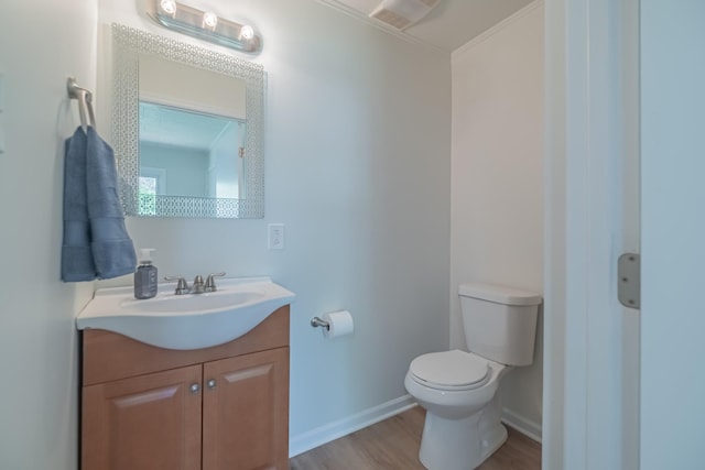 115 Highland Dr, Winchester, TN 37398 - bathroom with toilet, vanity, wood finished floors, and baseboards