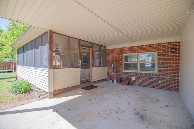 115 Highland Dr, Winchester, TN 37398 - view of patio with a sunroom and an attached carport