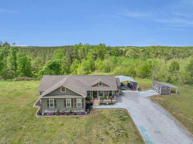 520 Young Rd, Waverly, TN 37185 - craftsman house featuring driveway, a porch, board and batten siding, a forest view, and a front yard