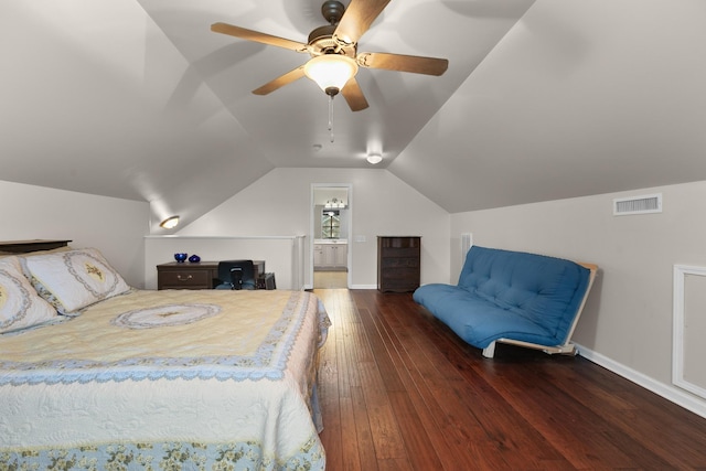 bedroom featuring connected bathroom, a ceiling fan, visible vents, lofted ceiling, and hardwood / wood-style flooring