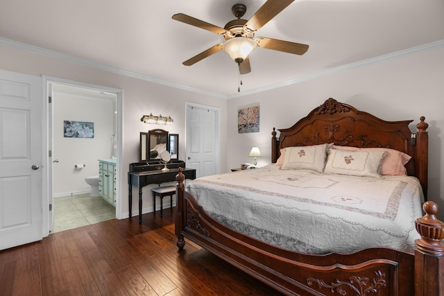 bedroom with baseboards, ornamental molding, ensuite bathroom, a ceiling fan, and wood finished floors