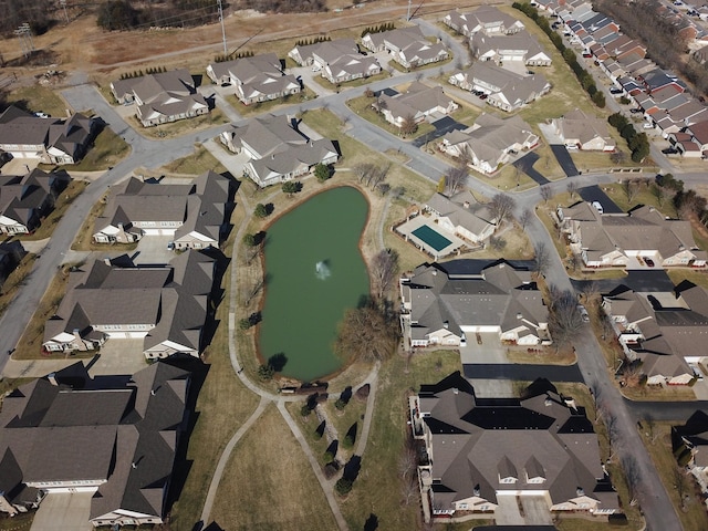birds eye view of property with a residential view and a water view