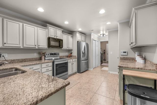 kitchen featuring a sink, recessed lighting, crown molding, and stainless steel appliances