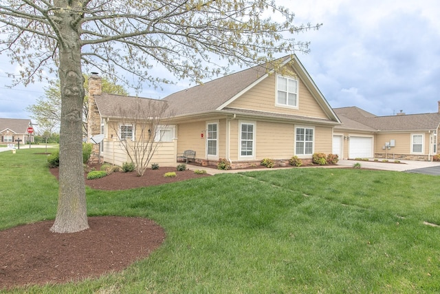 view of front facade featuring a front yard, a shingled roof, a garage, a chimney, and concrete driveway