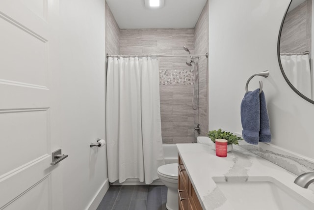 bathroom with shower / bath combo with shower curtain, vanity, and toilet