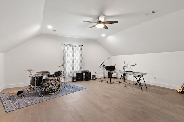 recreation room with wood finished floors, baseboards, vaulted ceiling, and ceiling fan