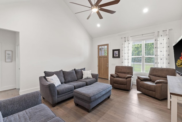 living room with high vaulted ceiling, recessed lighting, wood finished floors, and ceiling fan