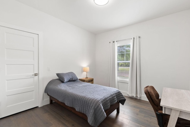 bedroom featuring wood finished floors