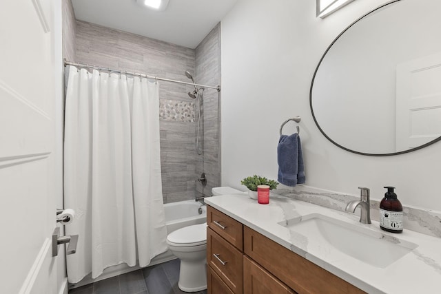 bathroom featuring shower / bath combo, vanity, and toilet