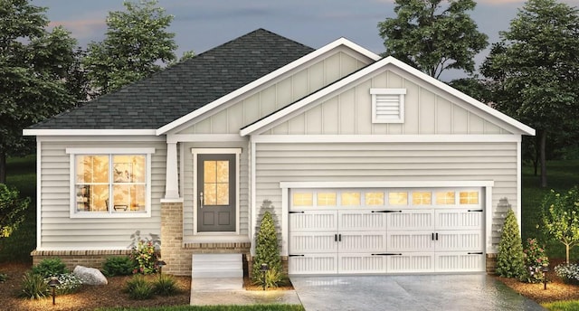 view of front of property featuring board and batten siding, an attached garage, a shingled roof, and driveway