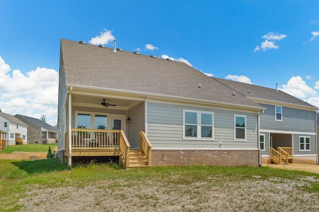 back of property with brick siding, a ceiling fan, and a deck