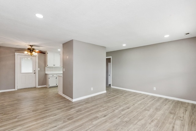 926 Rackley Dr, Pulaski, TN 38478 - unfurnished living room with recessed lighting, visible vents, light wood-type flooring, and baseboards