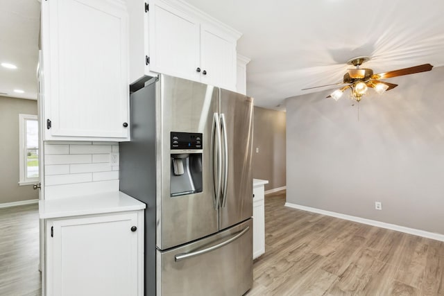 926 Rackley Dr, Pulaski, TN 38478 - kitchen featuring stainless steel fridge with ice dispenser, a ceiling fan, white cabinetry, light wood finished floors, and baseboards