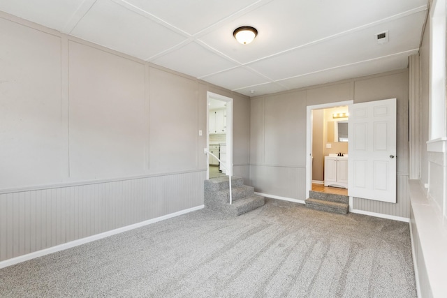 926 Rackley Dr, Pulaski, TN 38478 - carpeted spare room featuring a decorative wall, visible vents, and stairway