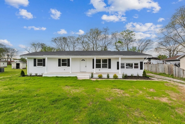 926 Rackley Dr, Pulaski, TN 38478 - back of property featuring central AC, a yard, covered porch, stucco siding, and fence