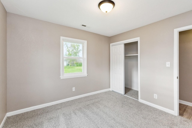 926 Rackley Dr, Pulaski, TN 38478 - unfurnished bedroom with a closet, baseboards, carpet, and visible vents
