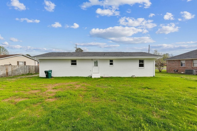 926 Rackley Dr, Pulaski, TN 38478 - rear view of house featuring brick siding, fence, cooling unit, and a lawn