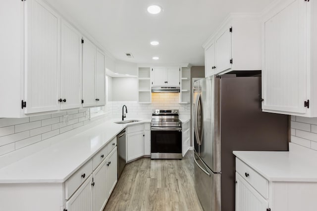 926 Rackley Dr, Pulaski, TN 38478 - kitchen featuring appliances with stainless steel finishes, open shelves, under cabinet range hood, decorative backsplash, and a sink