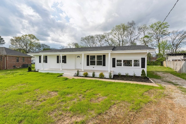 926 Rackley Dr, Pulaski, TN 38478 - ranch-style home with stucco siding, fence, a front lawn, and covered porch