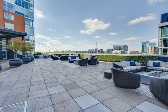 view of patio / terrace with an outdoor living space and a city view