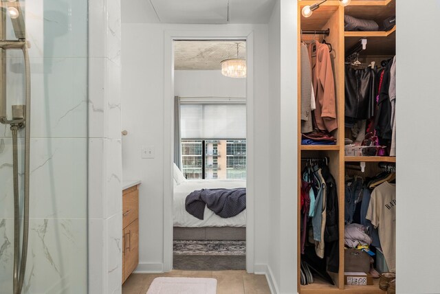 spacious closet featuring tile patterned floors