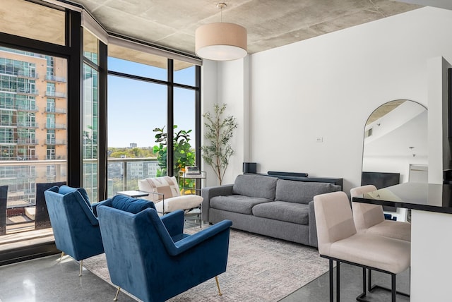 living area with floor to ceiling windows