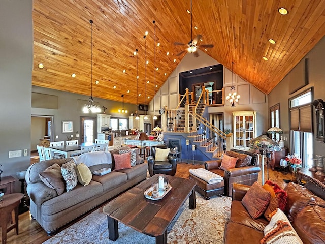 110 Giles Ln, Gallatin, TN 37066 - living room with a chandelier, wood finished floors, high vaulted ceiling, and stairway