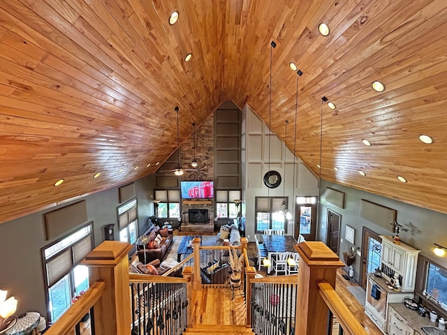 110 Giles Ln, Gallatin, TN 37066 - living area with a stone fireplace, high vaulted ceiling, recessed lighting, and wood ceiling