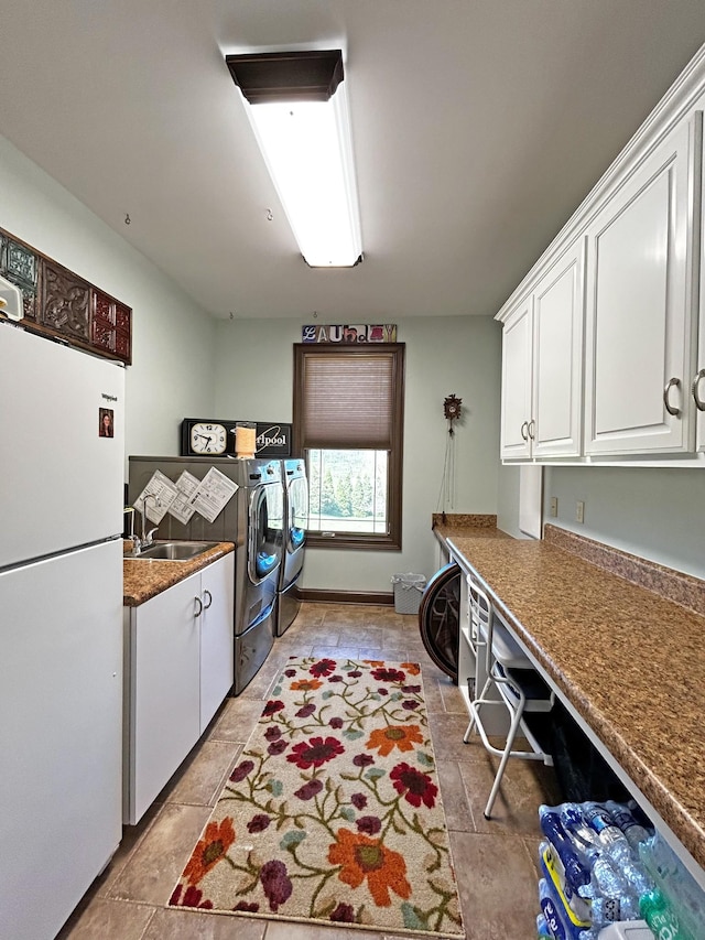 110 Giles Ln, Gallatin, TN 37066 - washroom featuring independent washer and dryer, a sink, and cabinet space