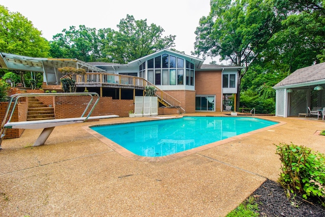 205 Hillwood Dr, Waverly, TN 37185 - swimming pool with stairs, a sunroom, a patio area, a diving board, and a deck