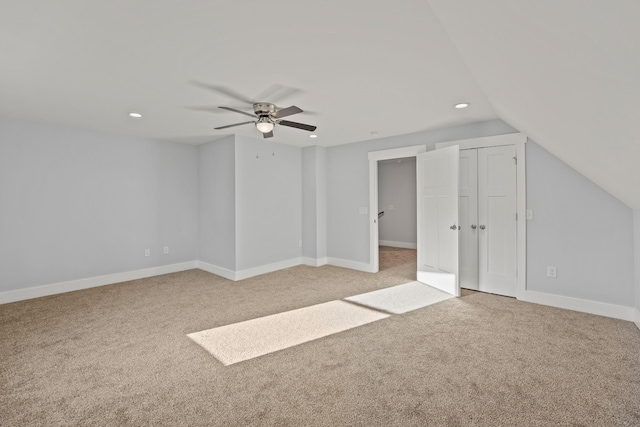 interior space with light carpet, recessed lighting, baseboards, and a ceiling fan