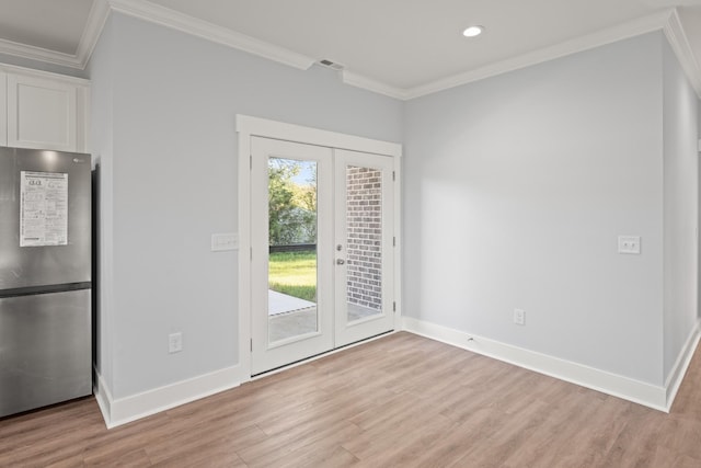 doorway featuring crown molding, french doors, baseboards, and light wood-style floors