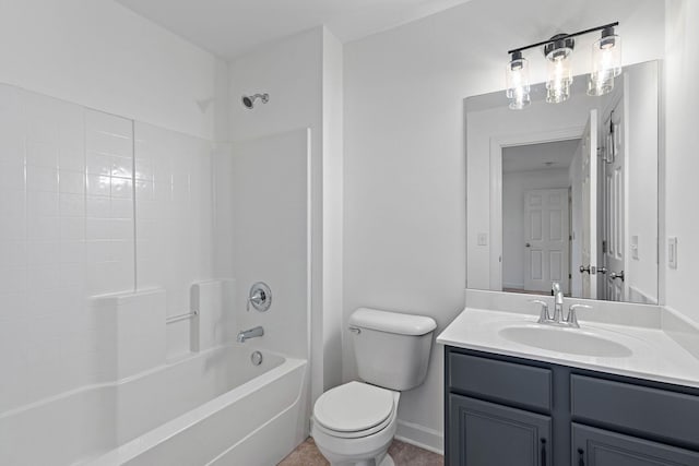bathroom featuring toilet, vanity, baseboards, and shower / washtub combination