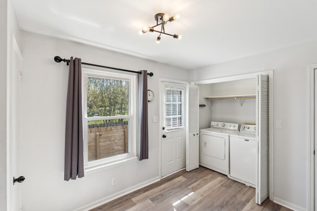 223 Edgewood Dr, Hendersonville, TN 37075 - laundry room featuring laundry area, light wood-style floors, an inviting chandelier, baseboards, and washing machine and dryer