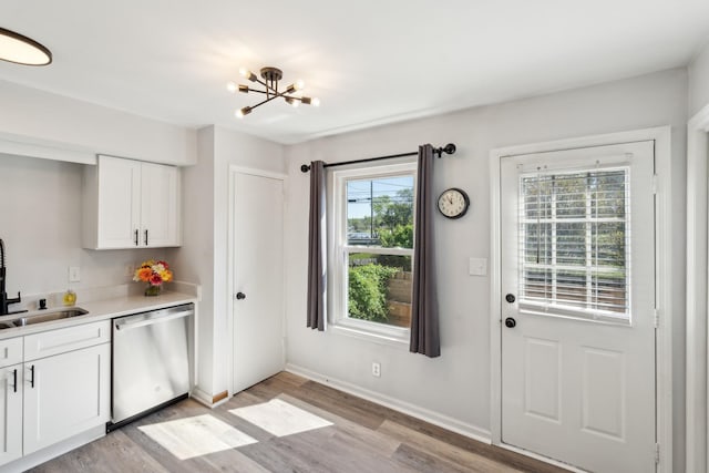 223 Edgewood Dr, Hendersonville, TN 37075 - entryway with a sink, baseboards, light wood-type flooring, and an inviting chandelier