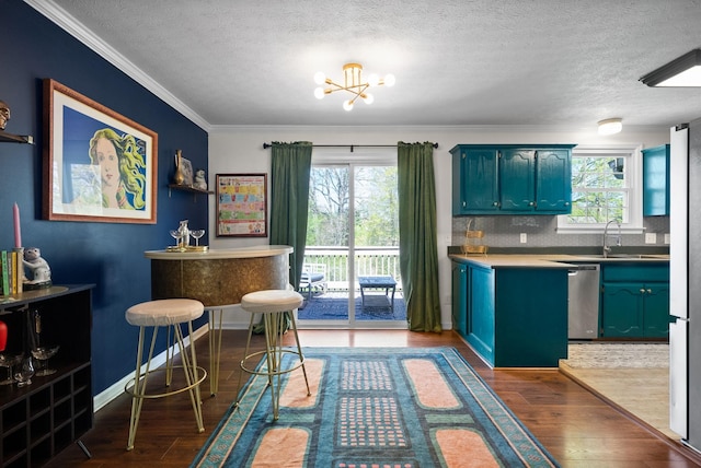 interior space with stainless steel dishwasher, a textured ceiling, and dark wood-style floors