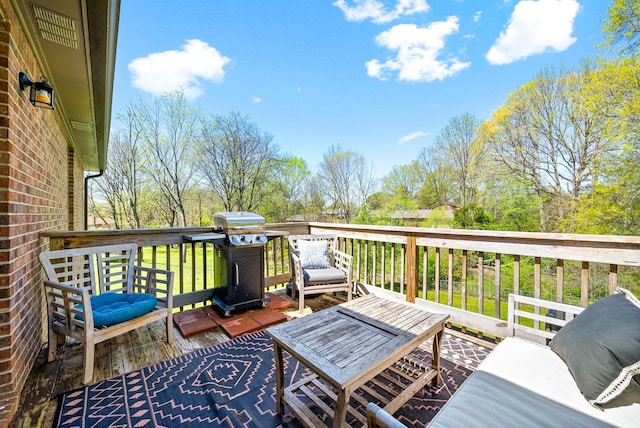 deck featuring an outdoor living space and grilling area