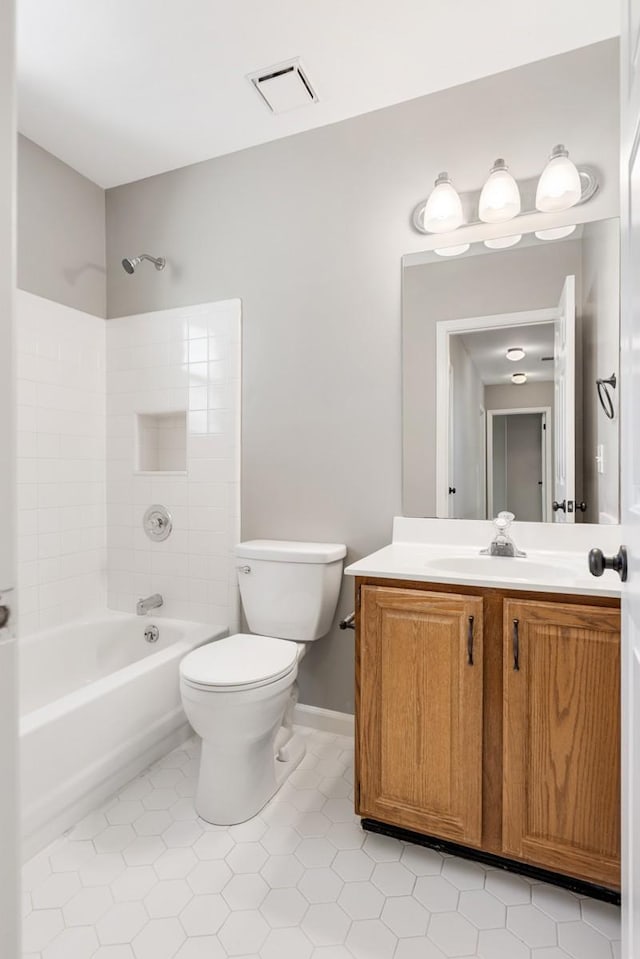 full bath with tile patterned flooring, visible vents, toilet, vanity, and  shower combination