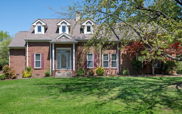 cape cod home with a front lawn, brick siding, roof with shingles, and crawl space
