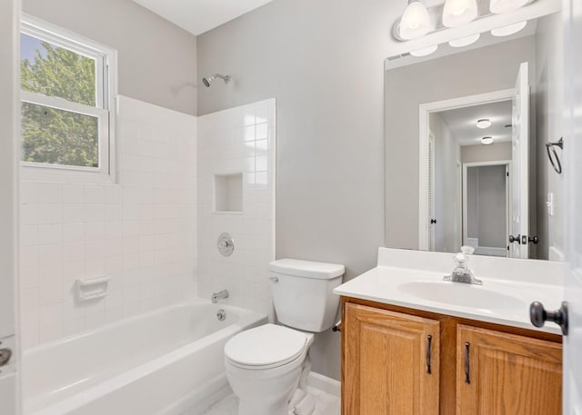 bathroom with baseboards, shower / bathtub combination, vanity, and toilet