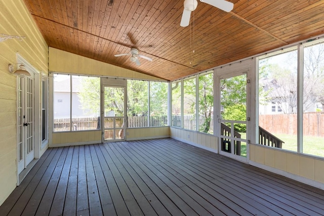 unfurnished sunroom with ceiling fan