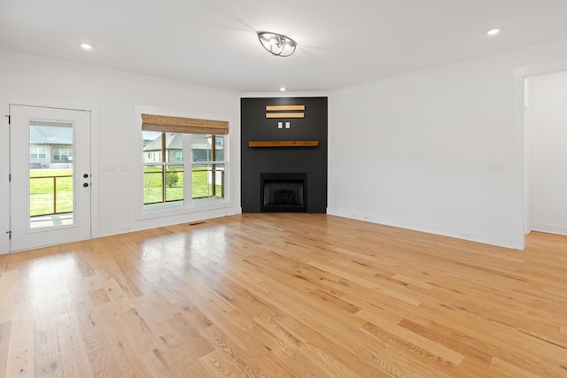 6913 Pembrooke Farms Dr, Murfreesboro, TN 37129 - unfurnished living room featuring light wood-type flooring, a fireplace, ornamental molding, visible vents, and recessed lighting