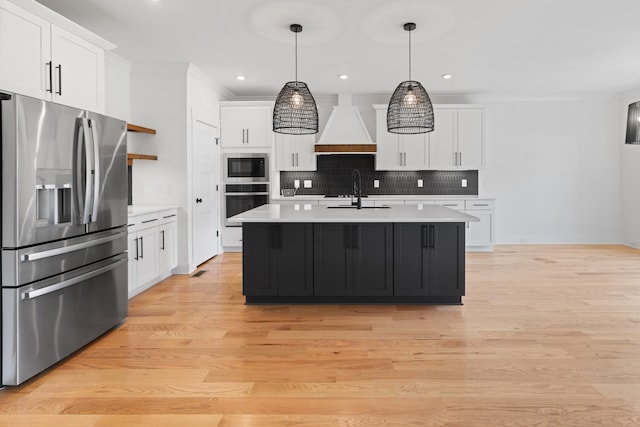 6913 Pembrooke Farms Dr, Murfreesboro, TN 37129 - kitchen with stainless steel appliances, a sink, custom exhaust hood, backsplash, and light countertops