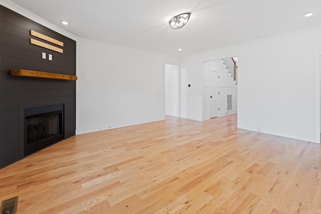 6913 Pembrooke Farms Dr, Murfreesboro, TN 37129 - unfurnished living room with wood finished floors, visible vents, stairs, and crown molding
