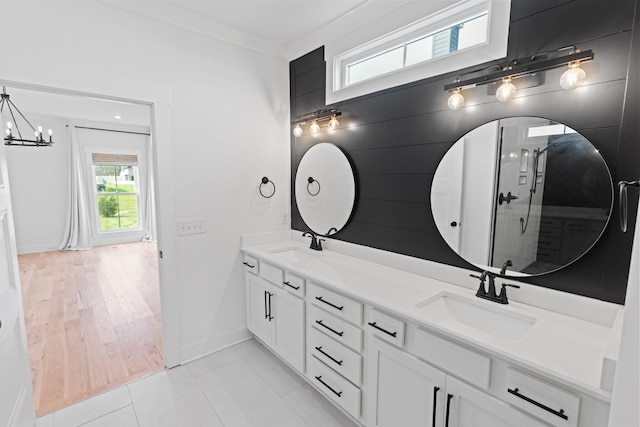 6913 Pembrooke Farms Dr, Murfreesboro, TN 37129 - full bathroom featuring baseboards, a chandelier, a sink, and double vanity