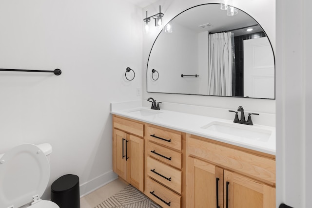 6913 Pembrooke Farms Dr, Murfreesboro, TN 37129 - bathroom featuring toilet, tile patterned floors, a sink, and double vanity