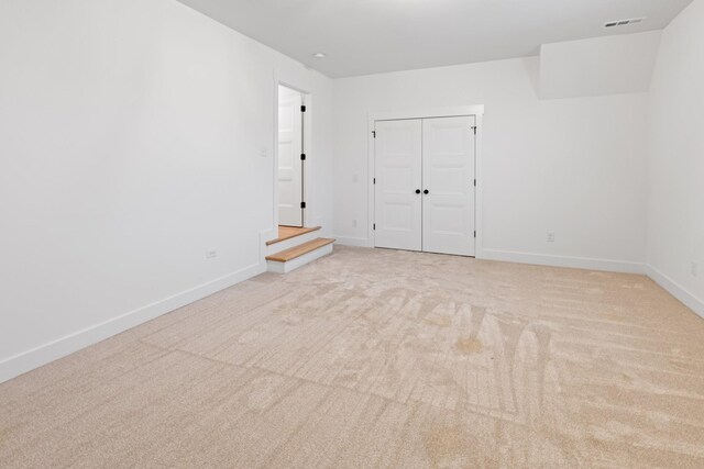 6913 Pembrooke Farms Dr, Murfreesboro, TN 37129 - spare room with baseboards, visible vents, and light colored carpet
