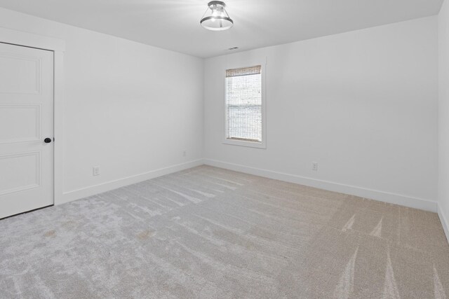 6913 Pembrooke Farms Dr, Murfreesboro, TN 37129 - spare room featuring baseboards and carpet