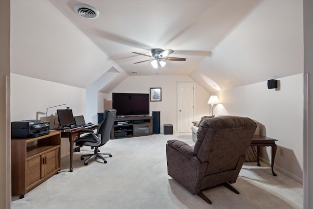 office featuring light carpet, ceiling fan, vaulted ceiling, and visible vents