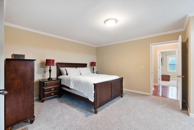 bedroom with crown molding, light colored carpet, and baseboards